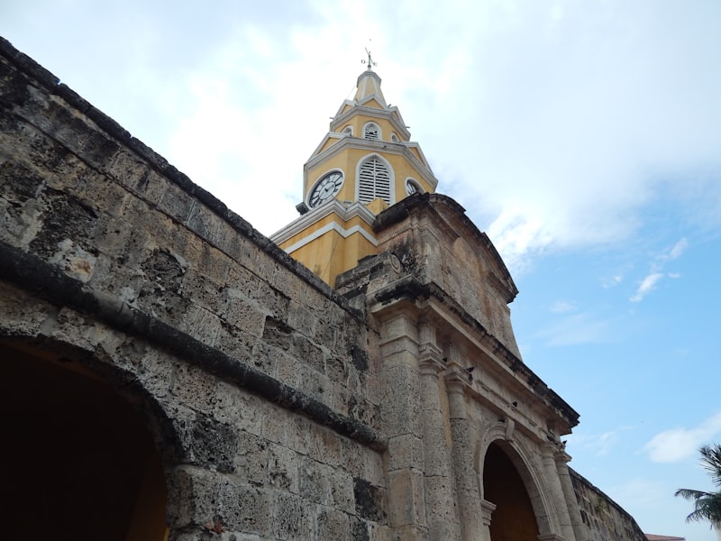 Old stone archway with clock tower above